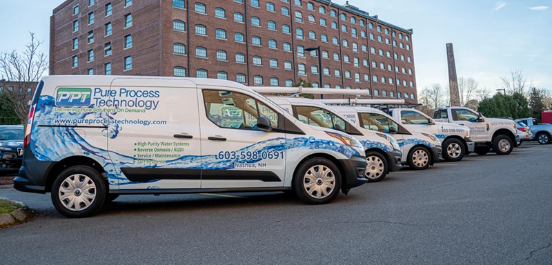 PPT vehicle fleet parked outside PPT location in Nashua, NH