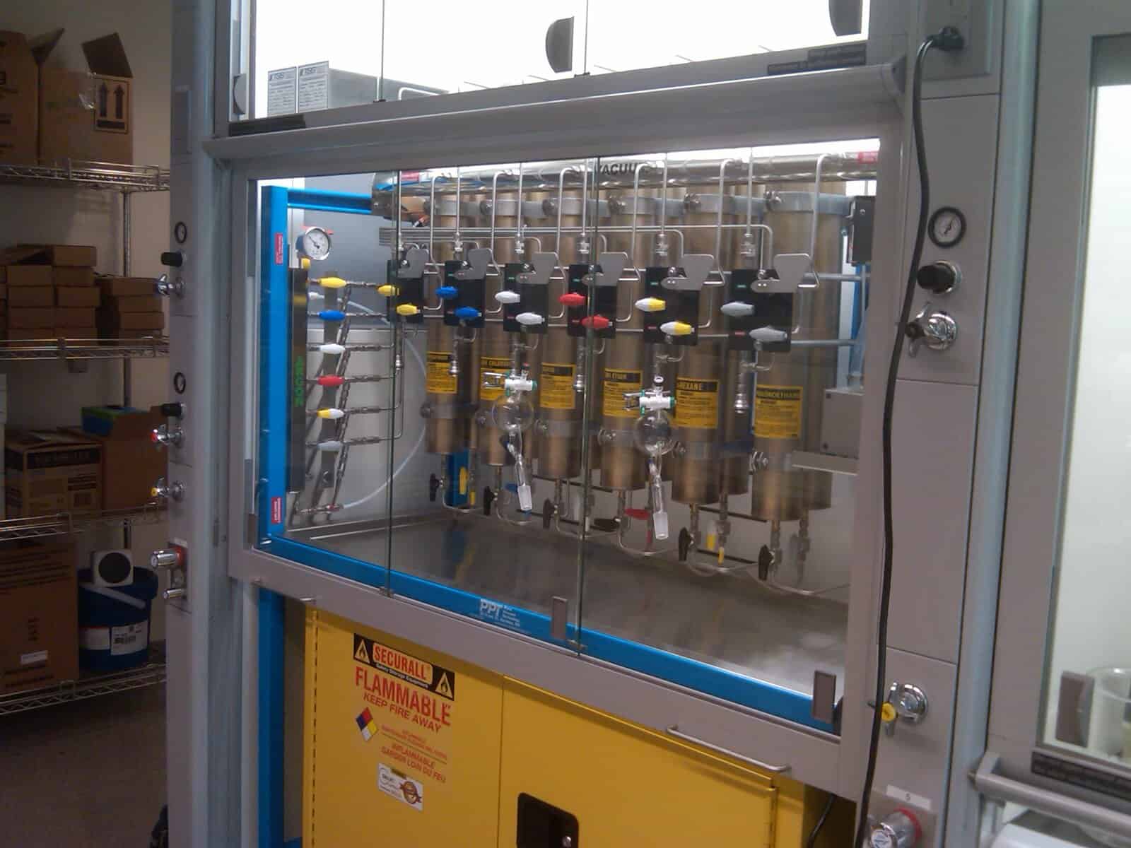 Multi-line solvent dispensing system integrated within a fume hood